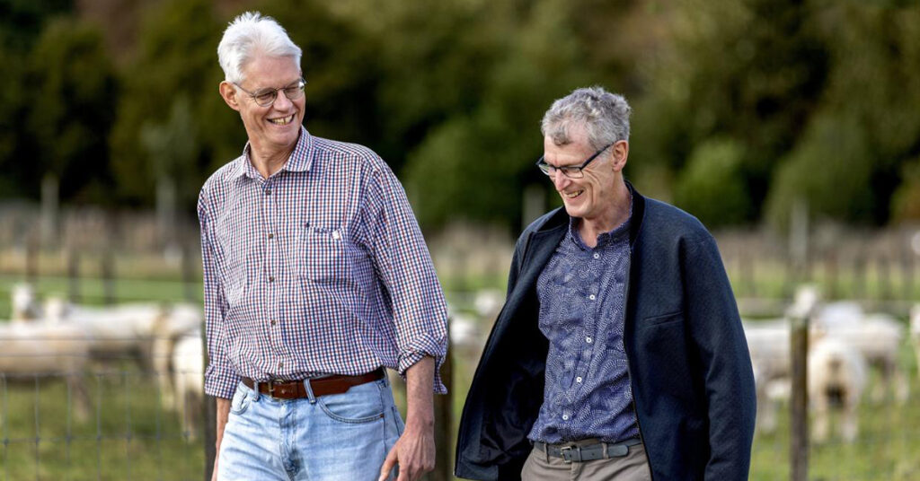 AgResearch scientists Peter Janssen and Neil Wedlock discussing the quest for a methane vaccine on a walk.
